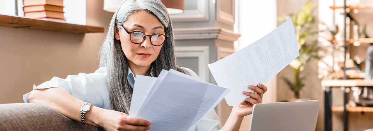 Woman with glasses trying to read