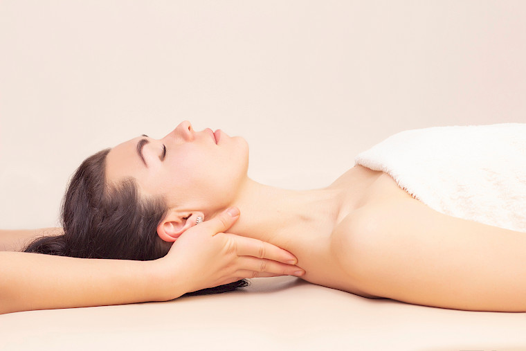 A woman is relaxing during a massage